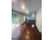 A spacious living room featuring hardwood floors, a fireplace, and natural light at 921 Winding Down Way, Grayson, GA 30017