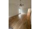Bright living room featuring light hardwood flooring and a ceiling fan at 921 Winding Down Way, Grayson, GA 30017