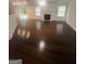 A spacious living room featuring hardwood floors, a fireplace, and natural light at 921 Winding Down Way, Grayson, GA 30017