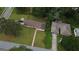 Aerial view of two homes with lush greenery and mature trees in a residential neighborhood at 503 Roy Huie Rd, Riverdale, GA 30274