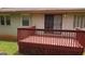 Exterior view of a wooden deck and the back of the house at 503 Roy Huie Rd, Riverdale, GA 30274