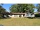 Charming single-story home with a well-maintained lawn and decorative lattice feature at 503 Roy Huie Rd, Riverdale, GA 30274