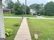 The front yard features a sidewalk leading to the home and well-manicured grass at 503 Roy Huie Rd, Riverdale, GA 30274