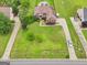 Aerial view featuring the well-manicured lawn, driveway and landscaping at 1535 Lake Dow Rd, Mcdonough, GA 30252