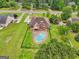 Aerial view showcasing the property's pool, deck, and expansive yard at 1535 Lake Dow Rd, Mcdonough, GA 30252