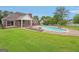Backyard with in-ground pool, deck, and large grassy area at 1535 Lake Dow Rd, Mcdonough, GA 30252