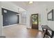 Bright, airy living room with hardwood floors and a tall ceiling with black accent wall at 1535 Lake Dow Rd, Mcdonough, GA 30252