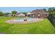 In-ground pool surrounded by a brick paver patio, deck and green grass at 1535 Lake Dow Rd, Mcdonough, GA 30252