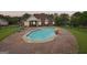 Backyard oasis with a kidney-shaped pool and brick patio at 1535 Lake Dow Rd, Mcdonough, GA 30252