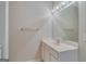 Bathroom featuring a large mirror, vanity with sink, and neutral walls at 124 Camry Sw Ln, Grayson, GA 30017