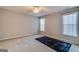 Bright bedroom with carpet, two windows, a ceiling fan, and a contrasting black rug at 124 Camry Sw Ln, Grayson, GA 30017