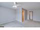 Spacious bedroom with plush carpet, neutral walls, and ceiling fan, offering a serene and inviting atmosphere at 124 Camry Sw Ln, Grayson, GA 30017
