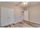 Bedroom featuring modern wood floors and neutral colored walls and double closet at 124 Camry Sw Ln, Grayson, GA 30017