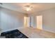 Spacious bedroom featuring carpet, neutral walls, a ceiling fan, and views to the bathroom at 124 Camry Sw Ln, Grayson, GA 30017