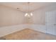 Elegant dining room with wainscoting, chandelier lighting, and neutral carpeting at 124 Camry Sw Ln, Grayson, GA 30017