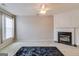 Comfortable living room featuring a fireplace, neutral decor, and ample natural light at 124 Camry Sw Ln, Grayson, GA 30017