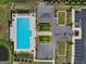 Aerial view showcasing a luxurious pool, manicured landscaping, and a well-designed clubhouse at 3525 Montebello Pkwy, Cumming, GA 30028