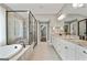 A spacious bathroom with dual vanity and glass shower at 3525 Montebello Pkwy, Cumming, GA 30028