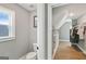View into a tiled bathroom with a closet and hardwood flooring at 3525 Montebello Pkwy, Cumming, GA 30028