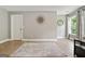 Bedroom with hardwood floors, neutral paint, and a modern rug at 3525 Montebello Pkwy, Cumming, GA 30028