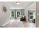Bedroom with hardwood floors, two large windows, and a modern rug at 3525 Montebello Pkwy, Cumming, GA 30028
