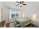 Bright bedroom with white trim, ceiling fan and a large window at 3525 Montebello Pkwy, Cumming, GA 30028