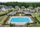 Community pool surrounded by lounge chairs and lush landscaping, offering a relaxing outdoor space at 3525 Montebello Pkwy, Cumming, GA 30028