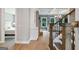 Inviting entryway with hardwood floors, staircase, and a glimpse into the bedroom and living room at 3525 Montebello Pkwy, Cumming, GA 30028