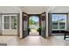Inviting foyer with a view of the front yard through the open double doors, featuring elegant hardwood floors at 3525 Montebello Pkwy, Cumming, GA 30028
