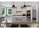 Gourmet kitchen with stainless steel appliances, a large island, and granite countertops at 3525 Montebello Pkwy, Cumming, GA 30028