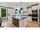 Modern kitchen with stainless steel appliances, a center island, and ample cabinet space at 3525 Montebello Pkwy, Cumming, GA 30028