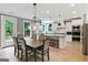 Eat-in kitchen featuring stainless steel appliances, a center island, and modern lighting at 3525 Montebello Pkwy, Cumming, GA 30028
