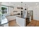 Spacious kitchen with a large island, stainless appliances, and hardwood floors at 3525 Montebello Pkwy, Cumming, GA 30028