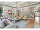 Open concept living space with a view of the kitchen, dining area, and staircase at 3525 Montebello Pkwy, Cumming, GA 30028