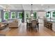Open concept living space with a living room, dining area, and modern kitchen at 3525 Montebello Pkwy, Cumming, GA 30028