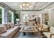 Open concept living space with a view of the kitchen, dining area, and coffered ceiling at 3525 Montebello Pkwy, Cumming, GA 30028