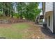 Expansive backyard featuring a well-maintained lawn and a charming wooden fence at 4733 Julian Way, Acworth, GA 30101