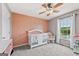 Bedroom with a crib, rocking chair, and large window for lots of natural light at 4733 Julian Way, Acworth, GA 30101