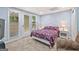 Inviting bedroom offers natural light, plush carpet, and a comfortable bed, perfect for relaxation at 4733 Julian Way, Acworth, GA 30101