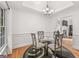 Dining room featuring decorative trim, a modern chandelier, and a round glass table at 4733 Julian Way, Acworth, GA 30101