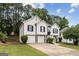 Charming two-story home features a two-car garage, classic white siding and a well-manicured lawn at 4733 Julian Way, Acworth, GA 30101