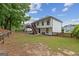 Exterior of home highlighting the backyard, wooden fence, and staircase to the deck at 4733 Julian Way, Acworth, GA 30101