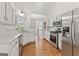 Well-lit kitchen featuring stainless steel appliances and white cabinetry at 4733 Julian Way, Acworth, GA 30101