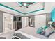 Primary bedroom showcases a gray accent wall, tray ceilings, and an ensuite bathroom at 4733 Julian Way, Acworth, GA 30101