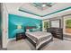 Spacious primary bedroom with a tray ceiling, two windows, a king bed, and ensuite bathroom at 4733 Julian Way, Acworth, GA 30101