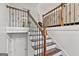 Classic staircase with wooden steps and decorative metal railing at 4733 Julian Way, Acworth, GA 30101
