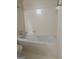 Bathroom featuring a soaking tub with tile surround and fixtures at 135 Courtyard Ln, Fayetteville, GA 30215