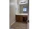 Bathroom featuring a vanity with sink and drawers and diagonal striped wallpaper at 135 Courtyard Ln, Fayetteville, GA 30215