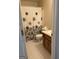 Bathroom featuring a patterned shower curtain and white floors and walls at 135 Courtyard Ln, Fayetteville, GA 30215