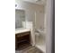 Bathroom featuring a vanity and bathtub with shower and sink at 135 Courtyard Ln, Fayetteville, GA 30215